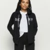 DKNY TRACK LOGO ZIP HOODI - Zip-up Sweatshirt - Black -Bag Haven Store 06b6049cc45b4592a25ca06e7f47f5a4