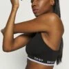 DKNY LOW IMPACT STRAPPY BRA REMOVABLE CUPS - Light Support Sports Bra - Black -Bag Haven Store 33c6f421daec4c849aacec7825794363