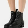DKNY BARRETT BOOT - Platform Ankle Boots - Black/white -Bag Haven Store 3eb8bbdac6a143a699db9800fa6e01dd