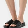 DKNY LAREN PLATFORM SLIDE - Mules - Black -Bag Haven Store 400a875f5f414b59a24a94c7b2d9b19c