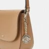 DKNY BRYANT SADDLE BAG - Across Body Bag - Cashew 10 DKNY BRYANT SADDLE BAG - Across Body Bag - Cashew -Bag Haven Store 4ff2435c0bc84e3f83a0715fb84446c0