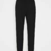 DKNY STACKED CITY LOGO HIGH RISE - Tracksuit Bottoms - Black -Bag Haven Store 67836465f72a439e8ad10da564c64601