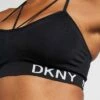 DKNY LOW IMPACT STRAPPYSEAMLESS BRA REMOVABLE CUPS - Light Support Sports Bra - Black -Bag Haven Store 68935b2daeec4e4da24801fab805ff97