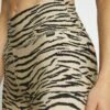 DKNY TIGER KING - Leggings - Latte -Bag Haven Store a1dca7205ac84bbfb7a79c79ee0423f8