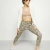 DKNY TIGER KING - Leggings - Latte -Bag Haven Store d476caadfa204d068de61a262bf972d4