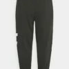 DKNY PIGMENT DYE DISTRESSED CRACKLE LOGO JOGGER - Tracksuit Bottoms - Black -Bag Haven Store df2598160f4845c0ab9818bba6f3420d