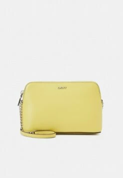 DKNY BRYANT DOME SUTTON - Across Body Bag - Spring Yellow