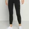 DKNY HIGH WAIST LEGGING CRISSCROSS SIDE BANDS - Leggings - Black -Bag Haven Store f736a7531c5947ae94ccaf1499e188da