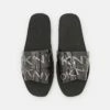 DKNY LOGO FLA SLIDE - Mules - Smoke Black -Bag Haven Store f81451cee9c04d28be085498ccff0a71