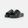DKNY LAREN PLATFORM SLIDE - Mules - Black -Bag Haven Store f8af1741ee3944f884b0c9226f644627