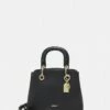 DKNY TONNY SATCHEL - Handbag - Black/gold-coloured -Bag Haven Store f8f41ebe4c3d473f9cd30a2b6e474338